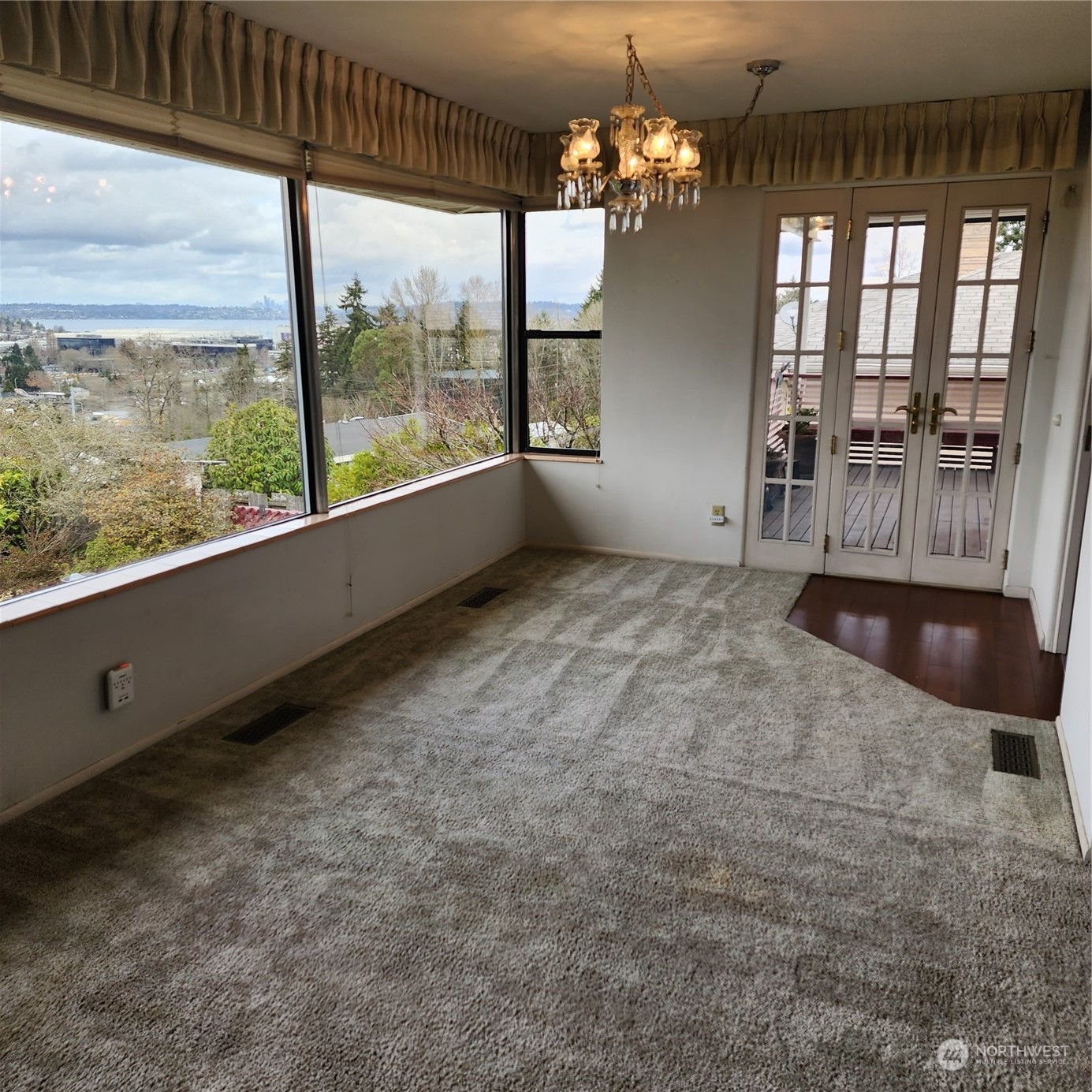 115 Monterey Place Northeast Renton, WA 98056 - Photo 7 of 35 wooden floor in an empty room with a window