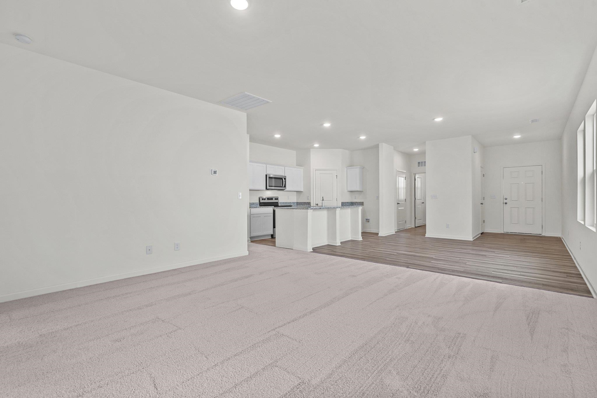 699 Cessna Drive Spring Hope, NC 27882 - Photo 18 of 29 a view of kitchen with refrigerator and a window