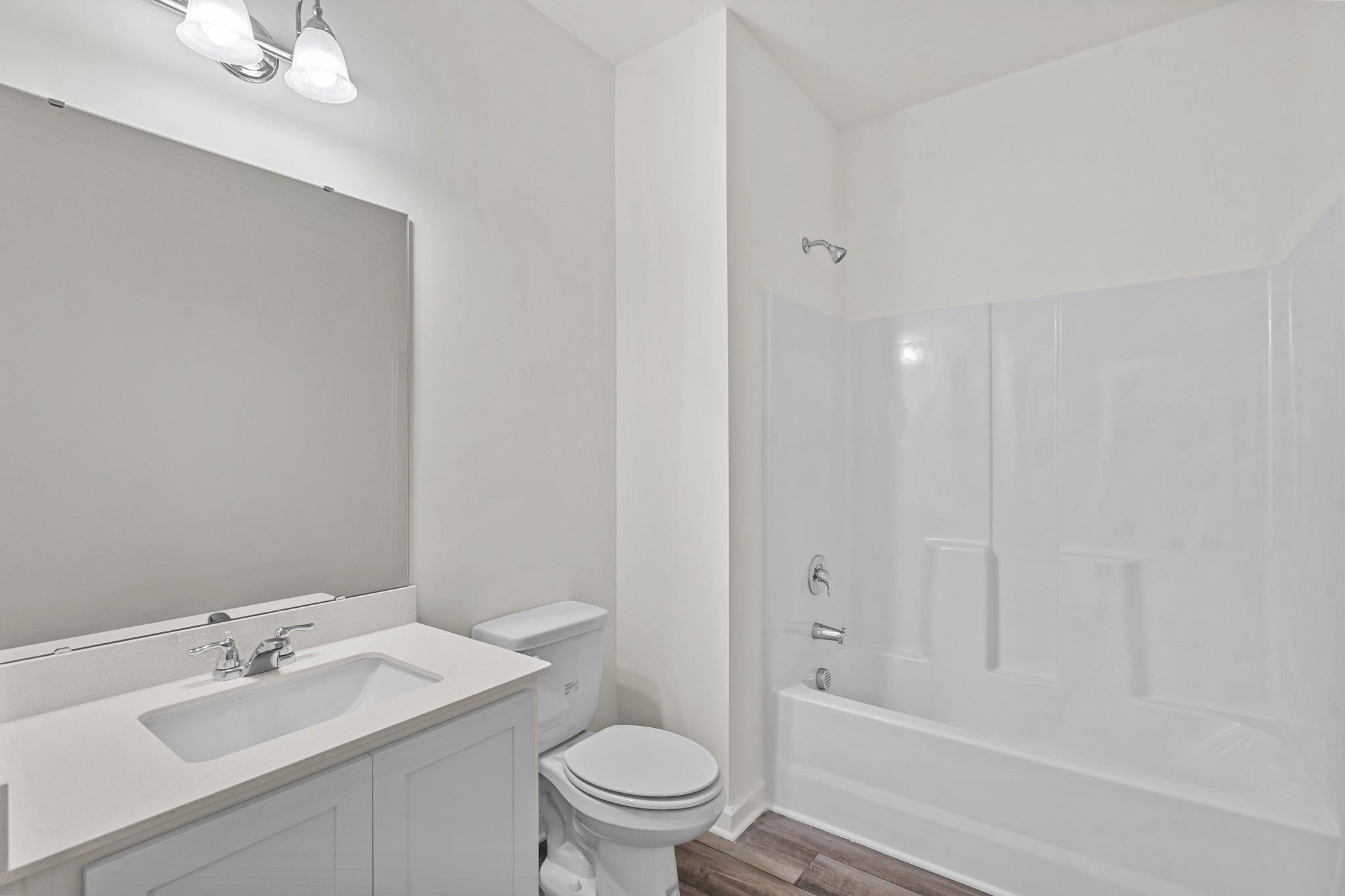 699 Cessna Drive Spring Hope, NC 27882 - Photo 20 of 29 a bathroom with a sink toilet and shower