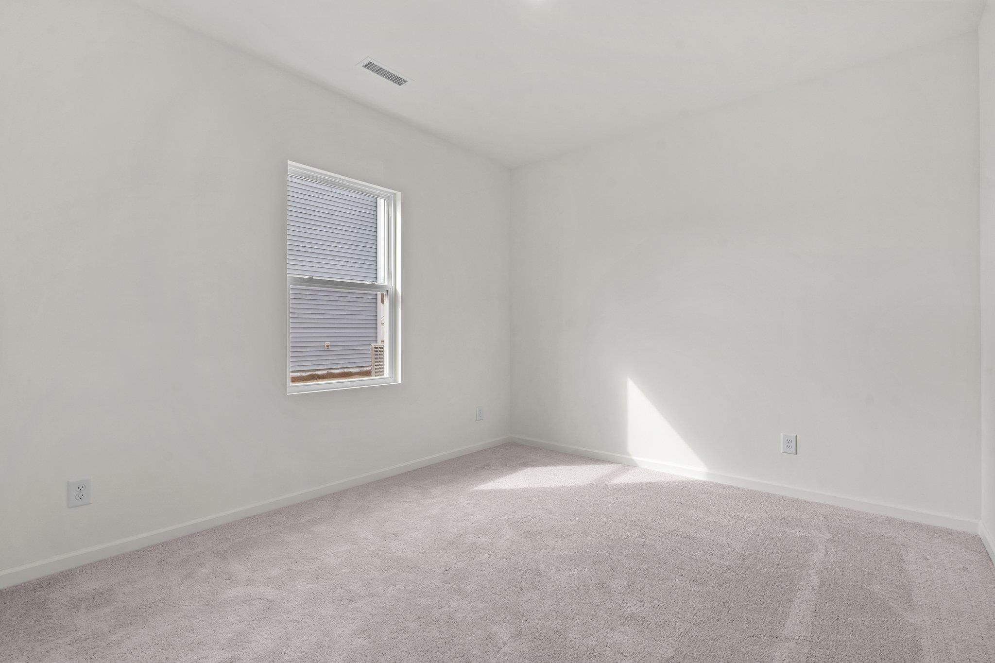 699 Cessna Drive Spring Hope, NC 27882 - Photo 22 of 29 a view of empty room with window