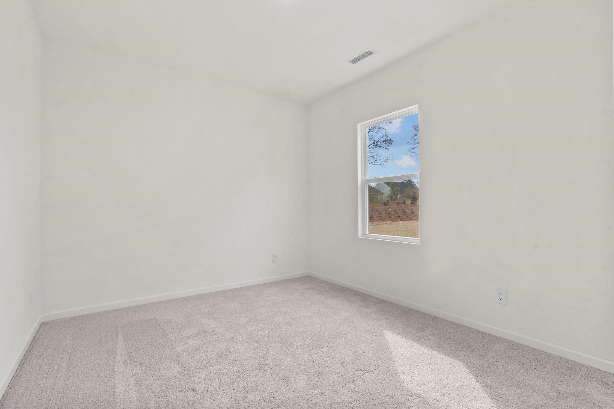 699 Cessna Drive Spring Hope, NC 27882 - Photo 24 of 29 a view of an empty room with a window