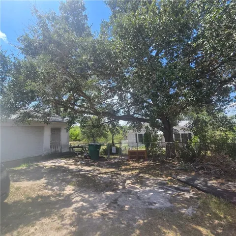 a backyard of a house with lots of green space