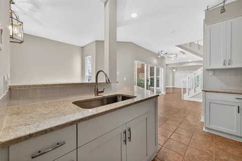 a kitchen with a sink and cabinets