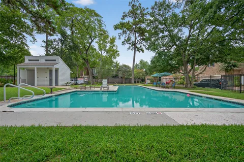 a view of green field with trees