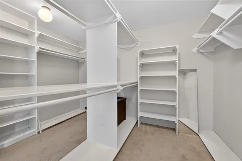 a view of an empty walk in closet