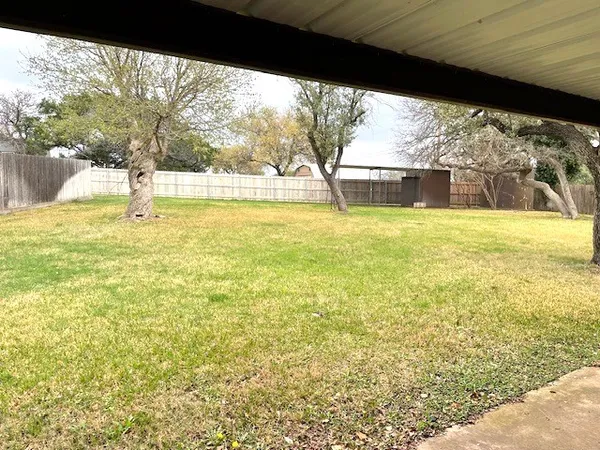a view of large pool with a yard