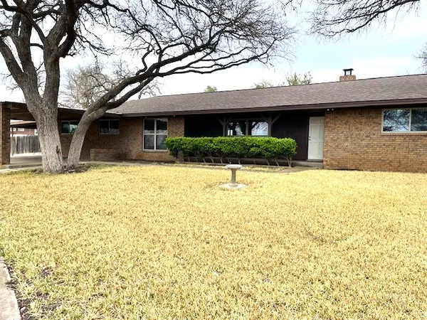 a view of house with yard