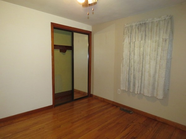 747 North Branch Parkway Springfield, MA 01119 - Photo 16 of 18 an empty room with wooden floor and a window