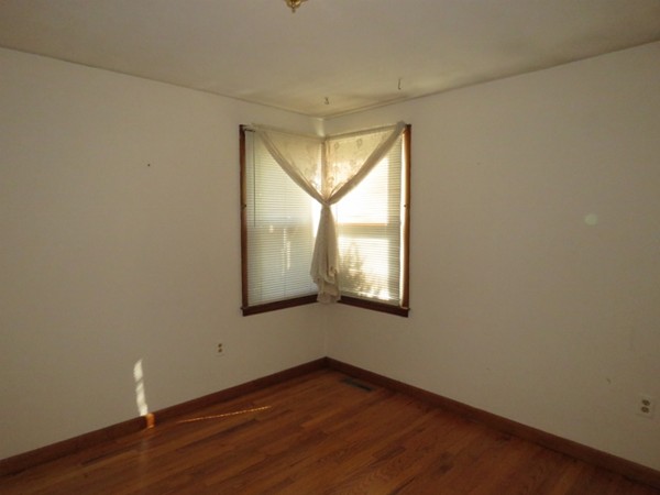 747 North Branch Parkway Springfield, MA 01119 - Photo 17 of 18 an empty room with wooden floor and windows