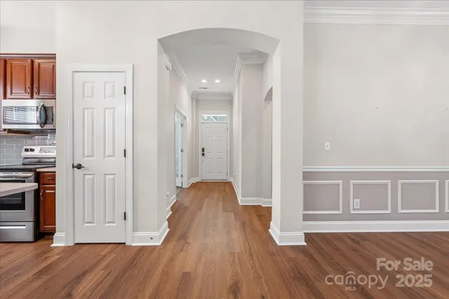a view of a kitchen wooden cabinets and wooden floor