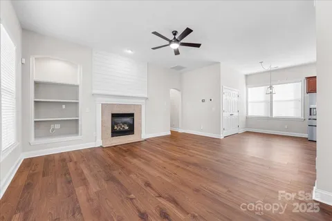 a bathroom with a tub sink shower and mirror