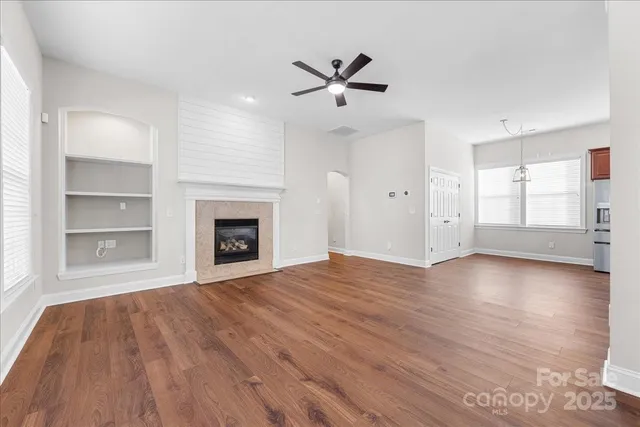 a bathroom with a tub sink shower and mirror