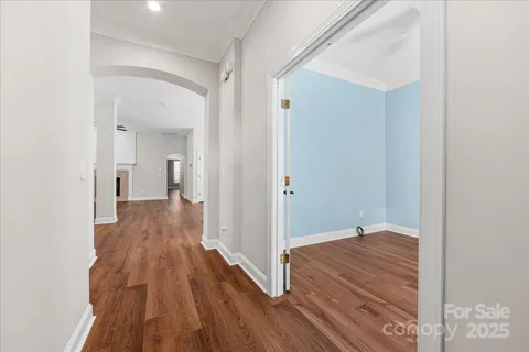 a living room with furniture fireplace and a large window