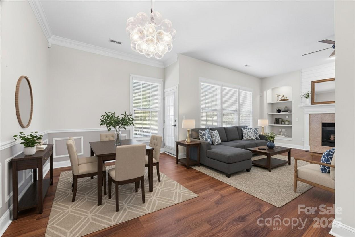 4148 Cedar Point Avenue Matthews, NC 28104 - Photo 8 of 48 a living room with furniture chandelier and a fireplace