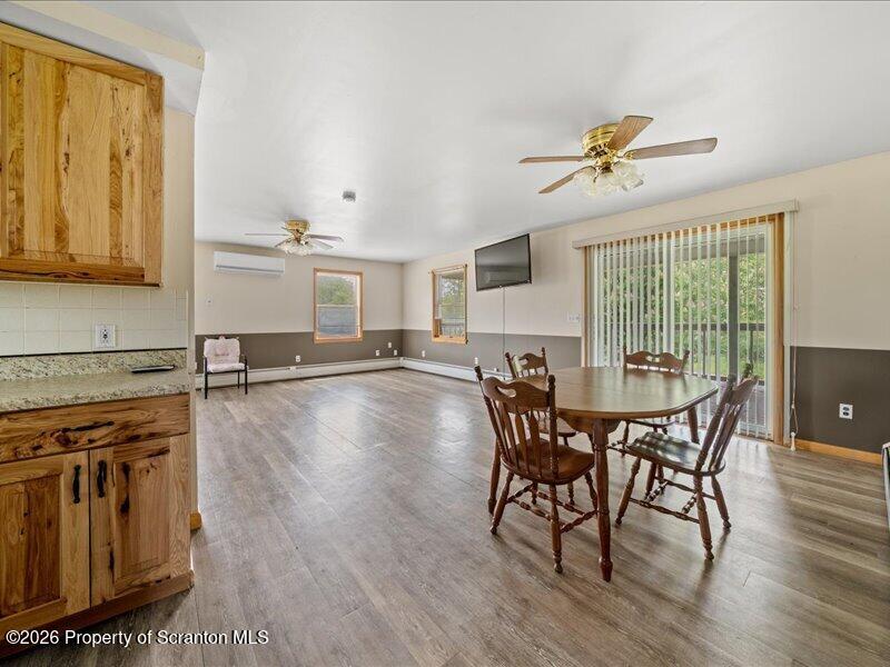 9-17 Vago Road Tunkhannock, PA 18657 - Photo 17 of 57 a view of a dining room with furniture window and wooden floor
