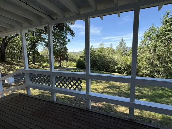 a view of a wooden bench from a window