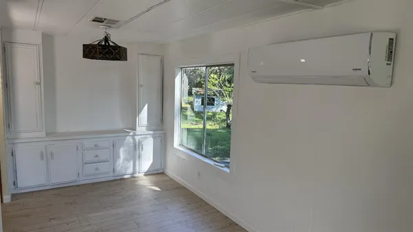 a view of an empty room with a window