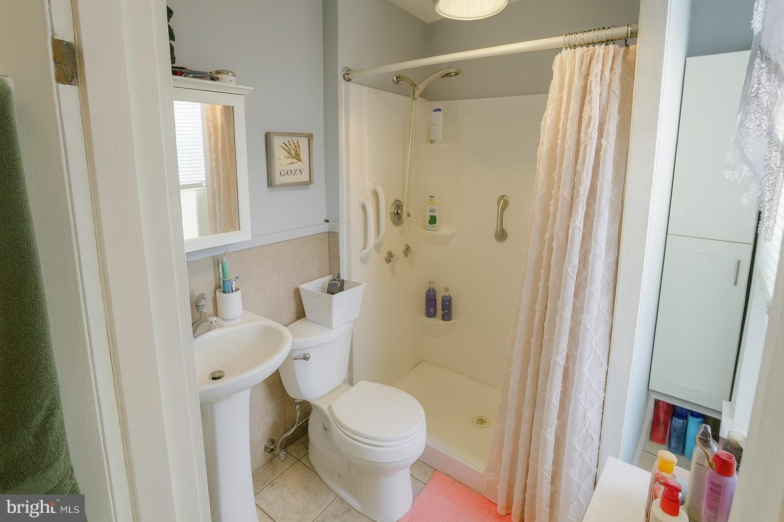 1535 Haak Street Reading, PA 19602 - Photo 11 of 33 a white toilet sitting next to a bathroom sink