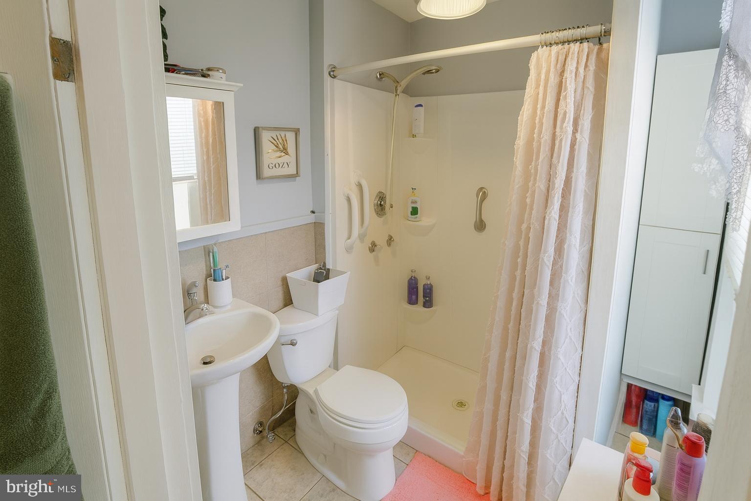 1535 Haak Street Reading, PA 19602 - Photo 12 of 33 a white toilet sitting next to a bathroom sink