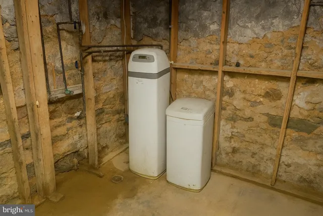 a utility room with a shower and mirror