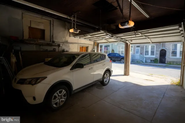 a car parked in front of a house