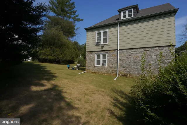 a backyard of a house with lots of green space