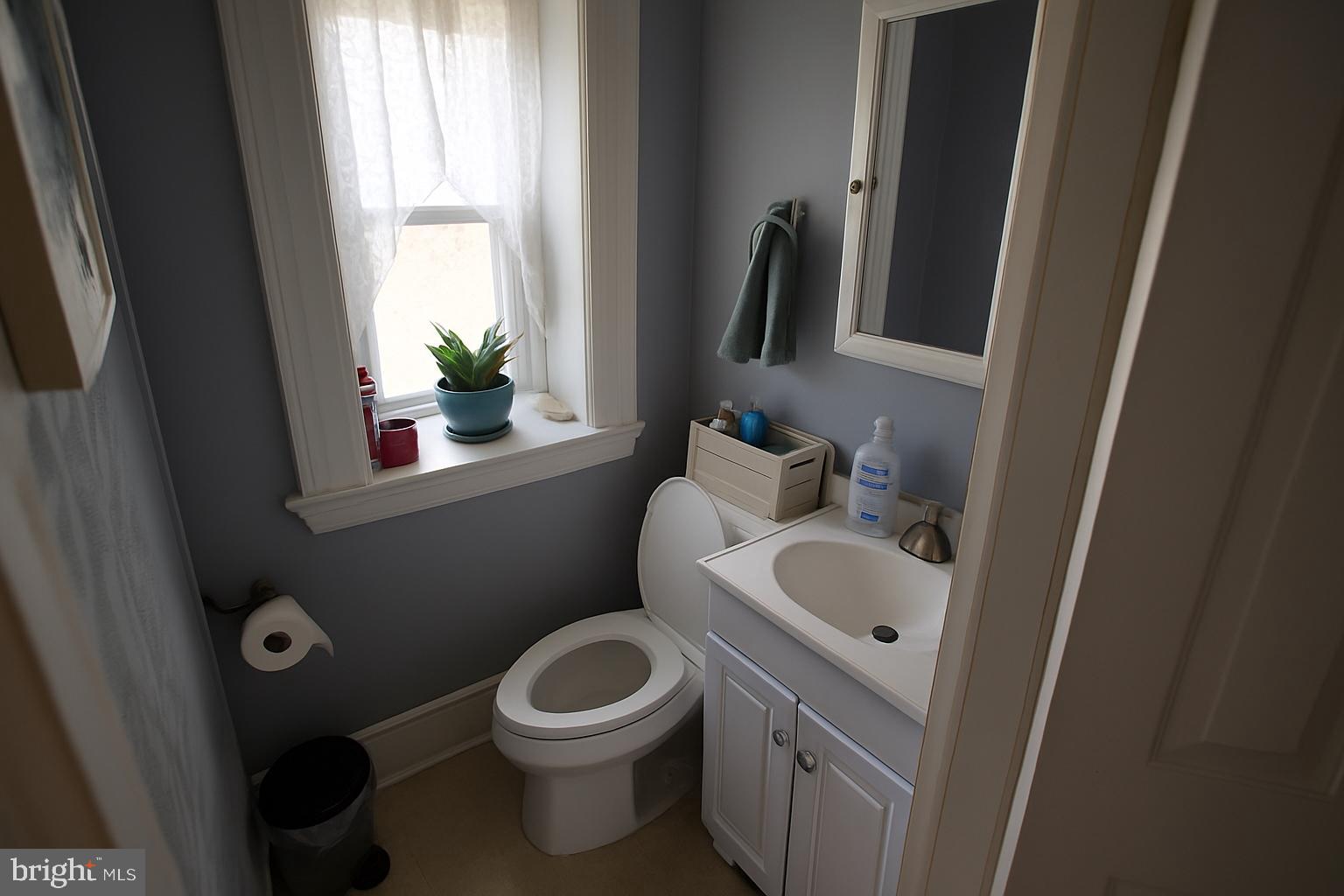 1535 Haak Street Reading, PA 19602 - Photo 10 of 33 a bathroom with a toilet sink and mirror