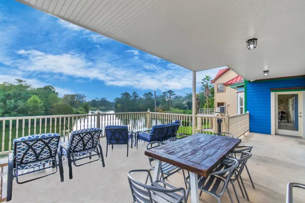 a view of a chairs and table in the patio