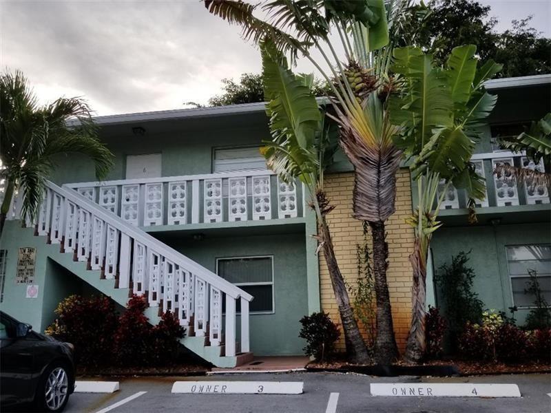2607 Northeast 8th Avenue, Unit 7 Wilton Manors, FL 33334 - Photo 19 of 23 a view of a house with a street