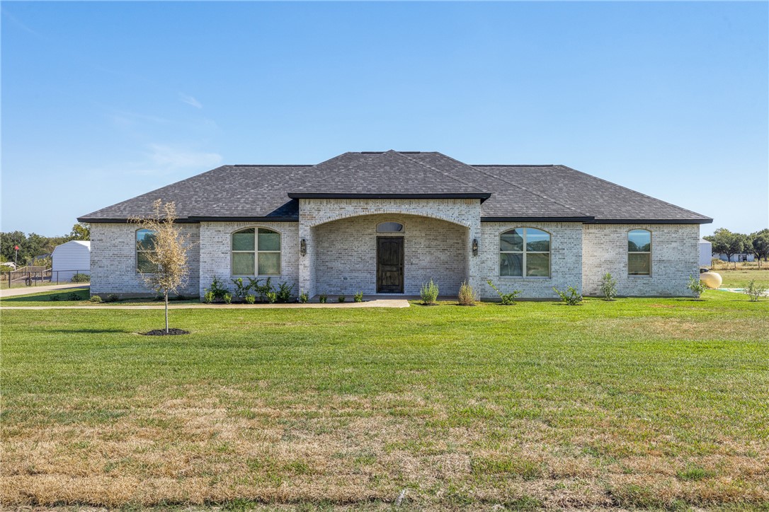 6524 Agave Court Bryan, TX 77808 - Photo 3 of 43 French provincial home featuring brick siding, a front lawn, and roof with shingles
