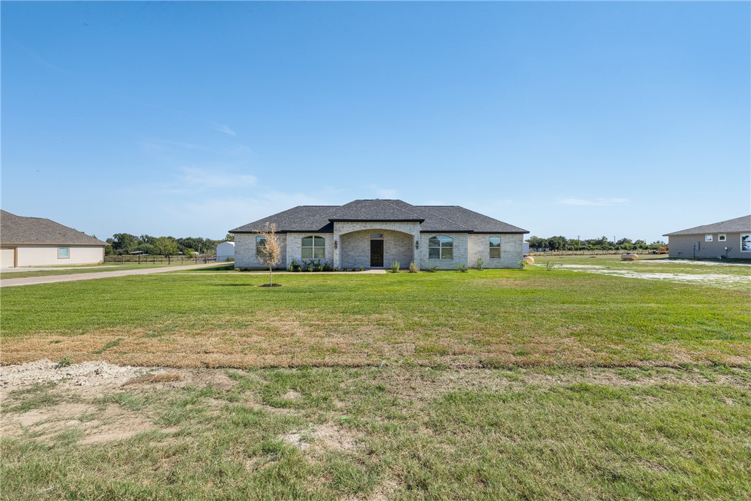 6524 Agave Court Bryan, TX 77808 - Photo 7 of 43 French country home featuring a front yard and brick siding