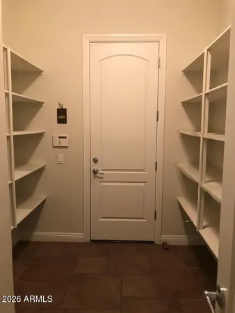 a view of an empty walk in closet