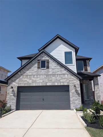 a front view of house with garage