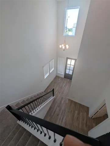 a view of a hallway with windows