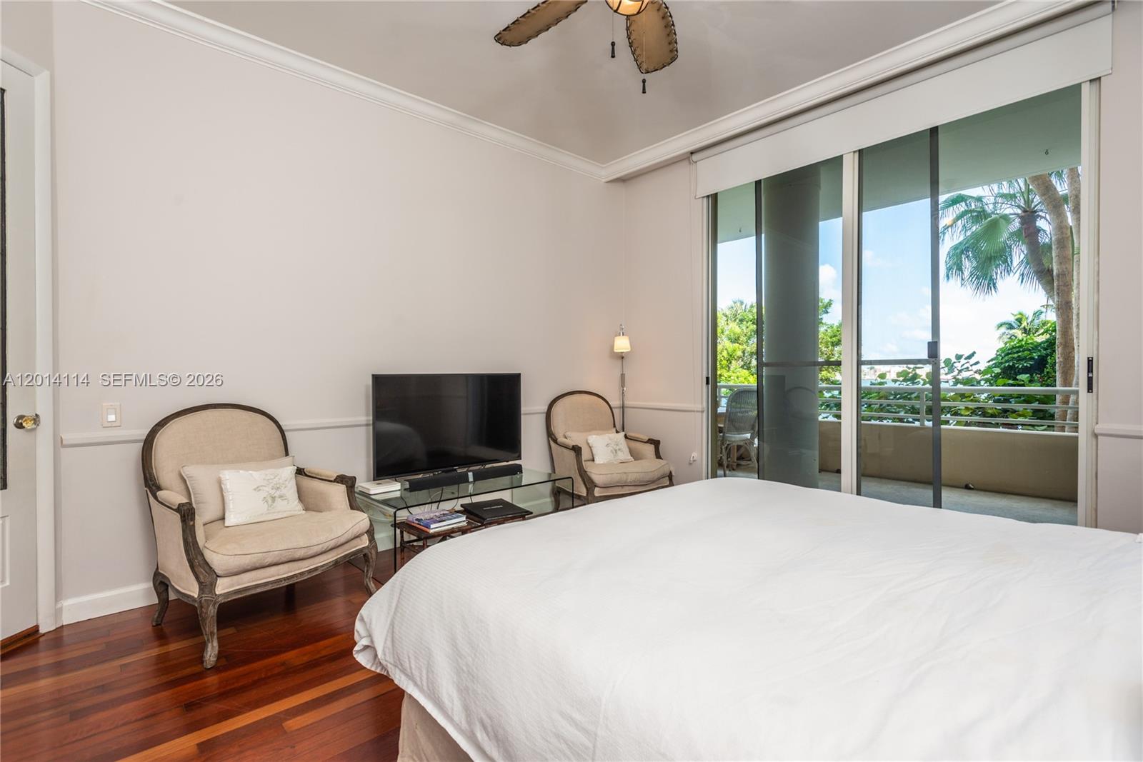 888 Brickell Key Drive, Unit 211 Miami, FL 33131 - Photo 12 of 28 a bedroom with bed and a large window