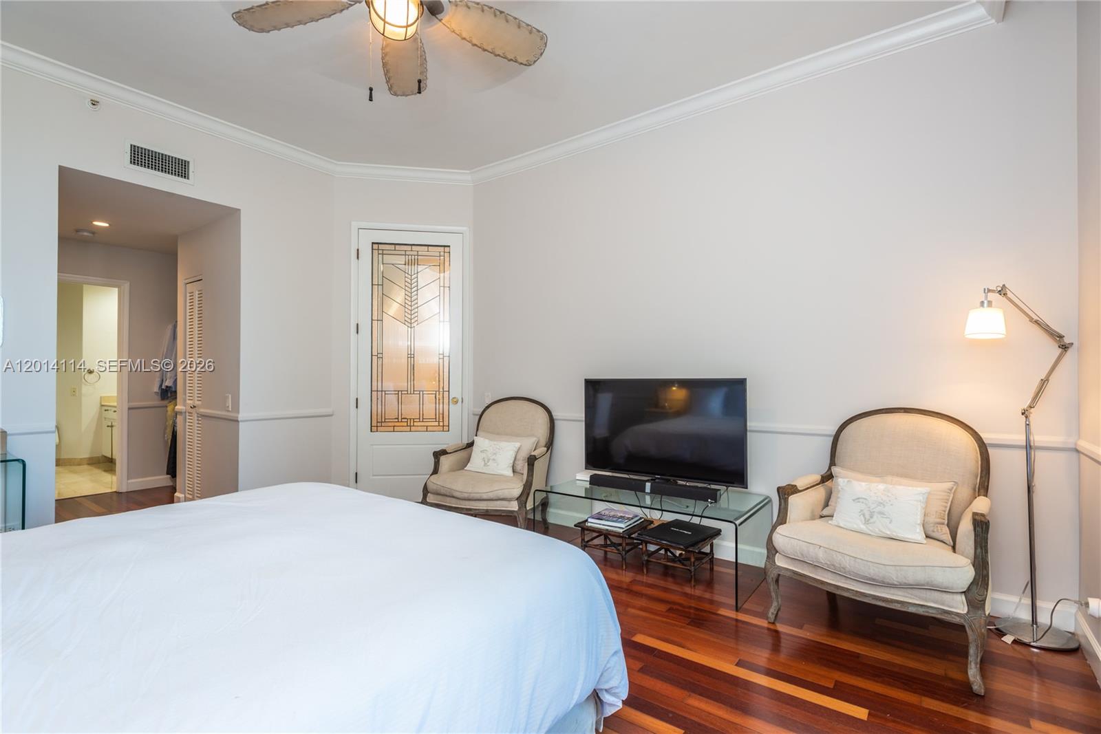 888 Brickell Key Drive, Unit 211 Miami, FL 33131 - Photo 13 of 28 a bedroom with a bed and a flat screen tv