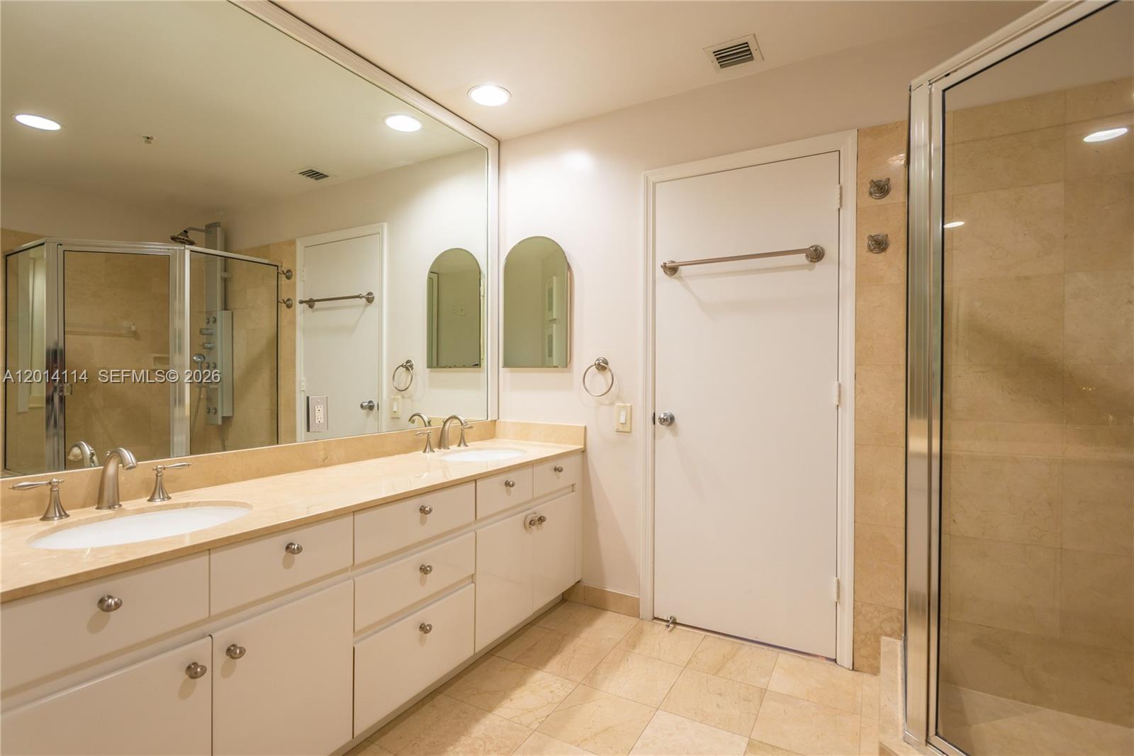 888 Brickell Key Drive, Unit 211 Miami, FL 33131 - Photo 14 of 28 a spacious bathroom with a double vanity sink mirror and double