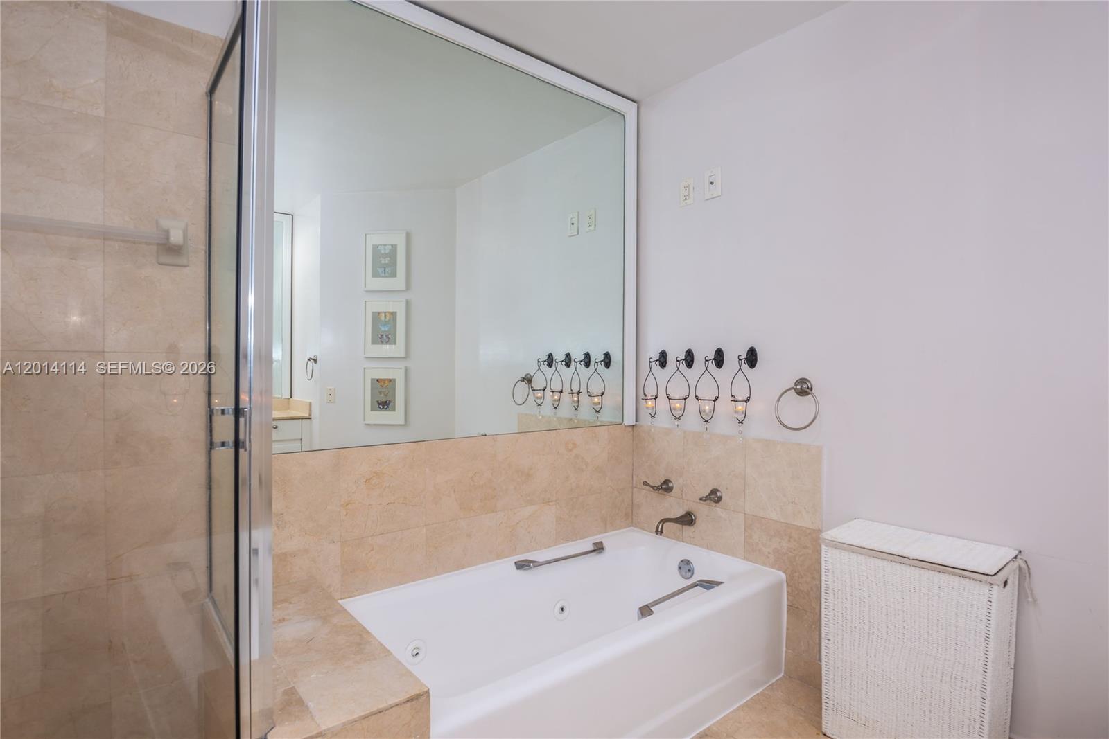 888 Brickell Key Drive, Unit 211 Miami, FL 33131 - Photo 16 of 28 a bathroom with a bathtub and a sink
