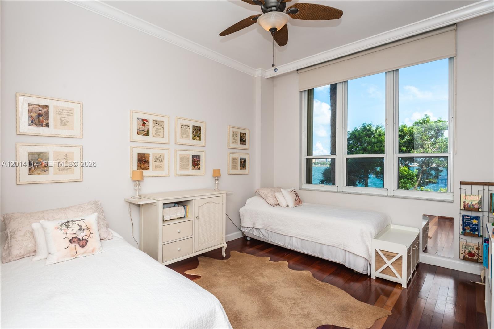 888 Brickell Key Drive, Unit 211 Miami, FL 33131 - Photo 17 of 28 a bedroom with a bed and a large window