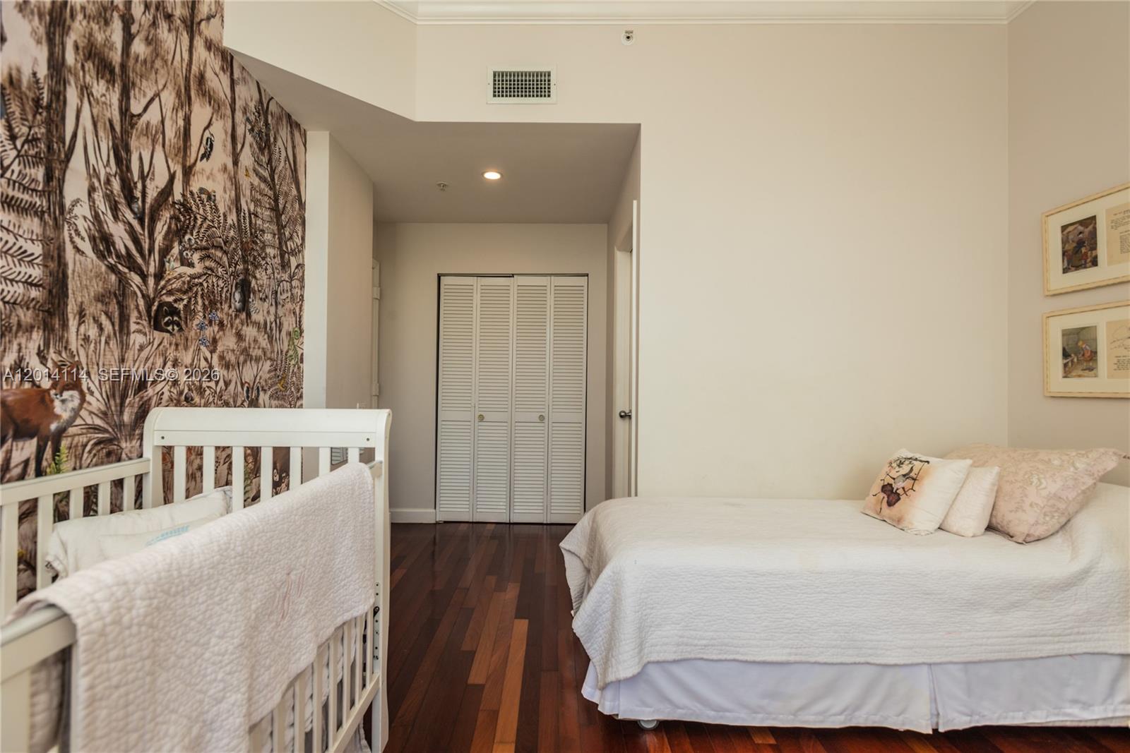 888 Brickell Key Drive, Unit 211 Miami, FL 33131 - Photo 19 of 28 a bedroom with a bed and a window