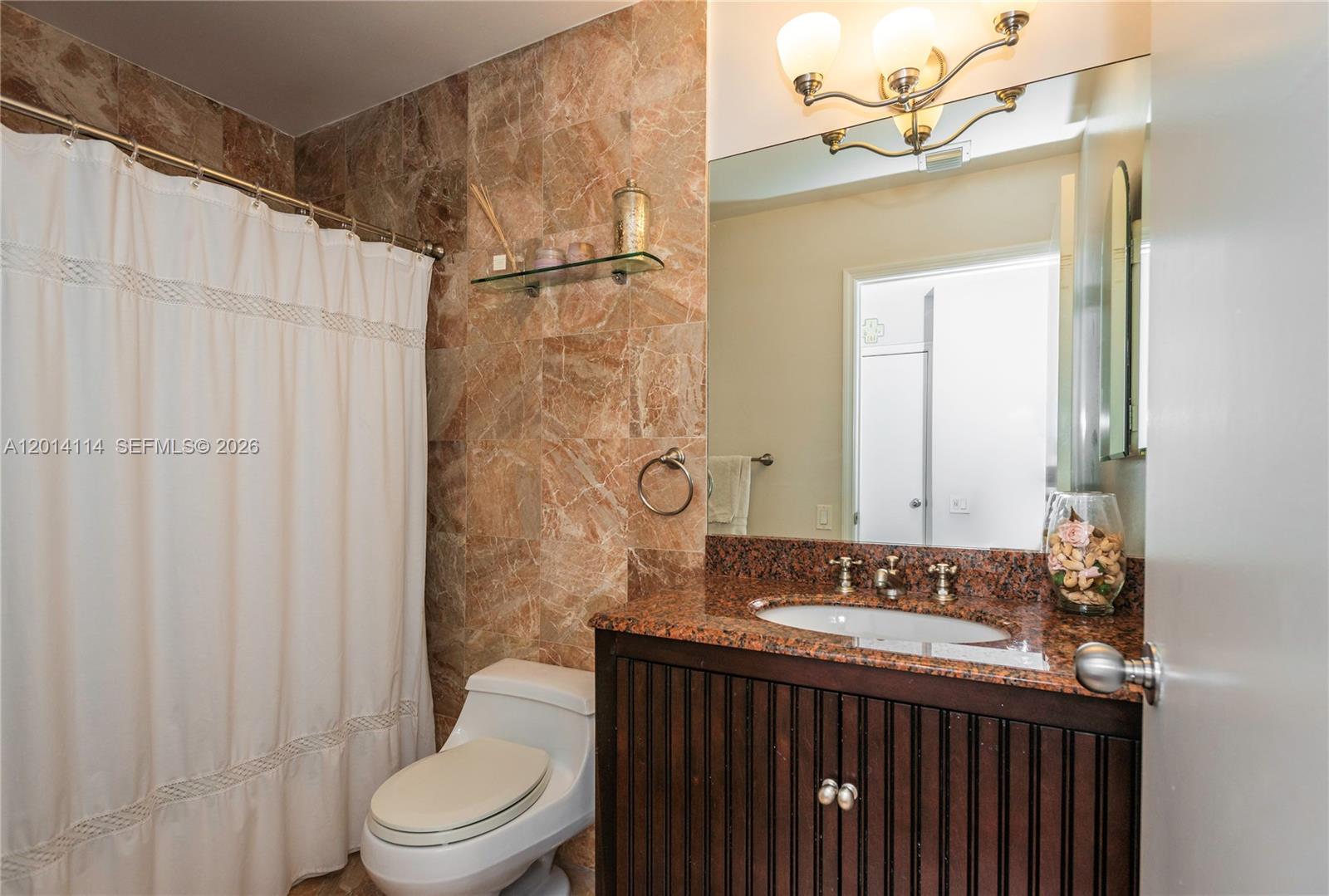 888 Brickell Key Drive, Unit 211 Miami, FL 33131 - Photo 20 of 28 a bathroom with a sink a toilet and shower