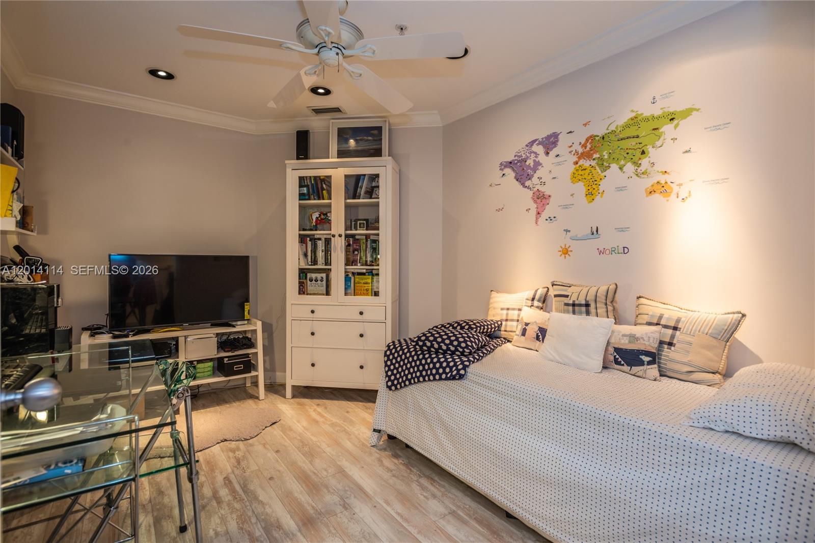 888 Brickell Key Drive, Unit 211 Miami, FL 33131 - Photo 21 of 28 a bedroom with furniture and a flat screen tv