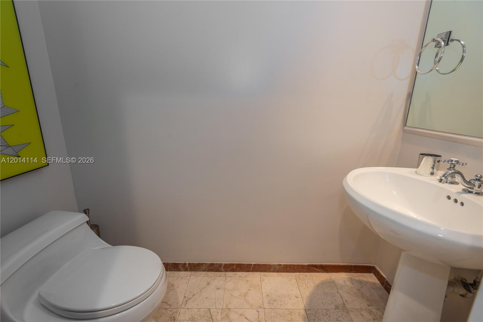 888 Brickell Key Drive, Unit 211 Miami, FL 33131 - Photo 22 of 28 a white toilet sitting next to a bathroom sink