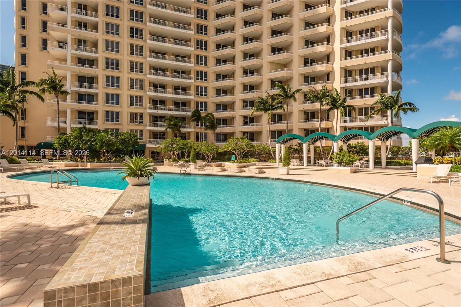 888 Brickell Key Drive, Unit 211 Miami, FL 33131 - Photo 24 of 28 a view of building with yard