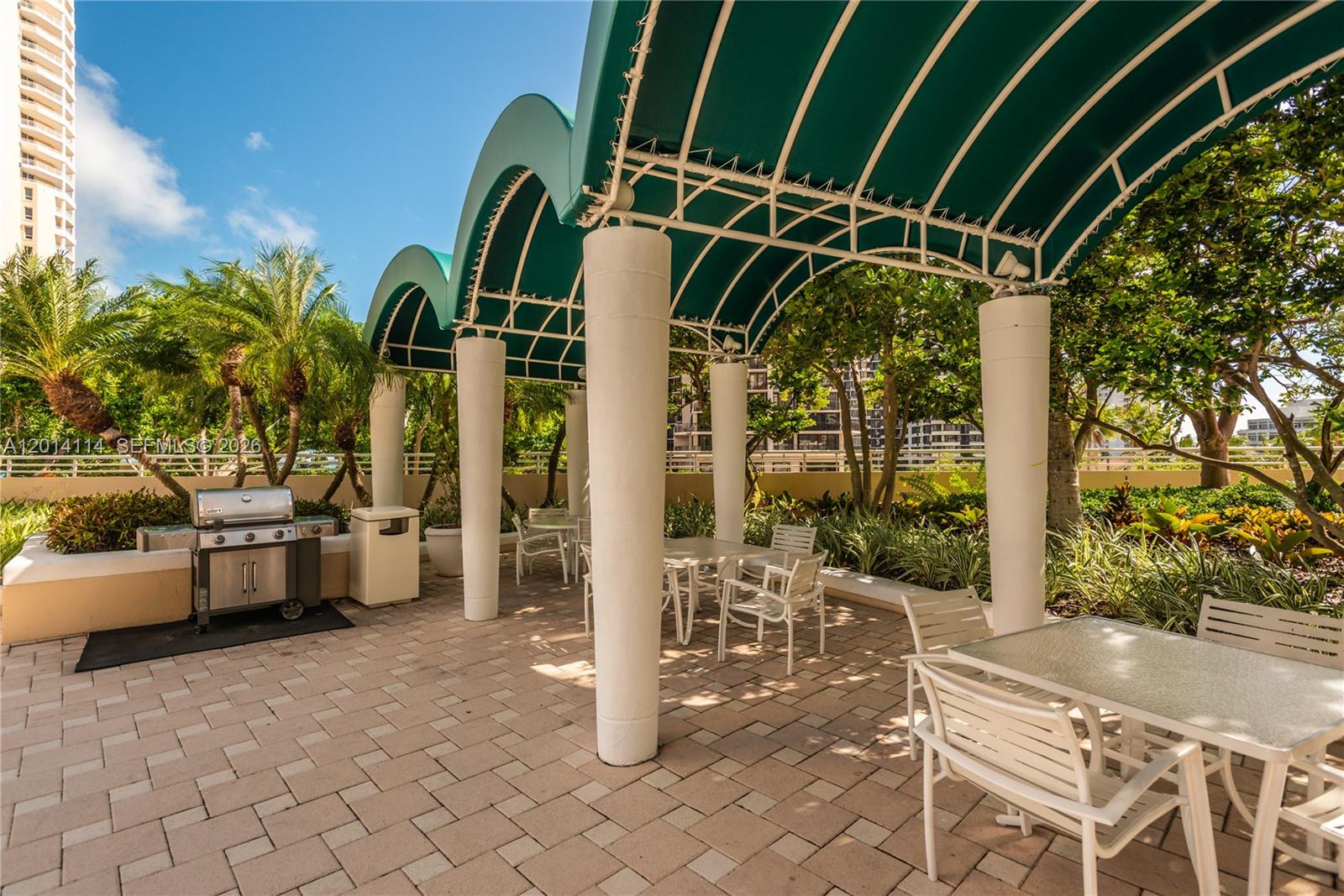 888 Brickell Key Drive, Unit 211 Miami, FL 33131 - Photo 25 of 28 a view of porch with a table and chairs and potted plants