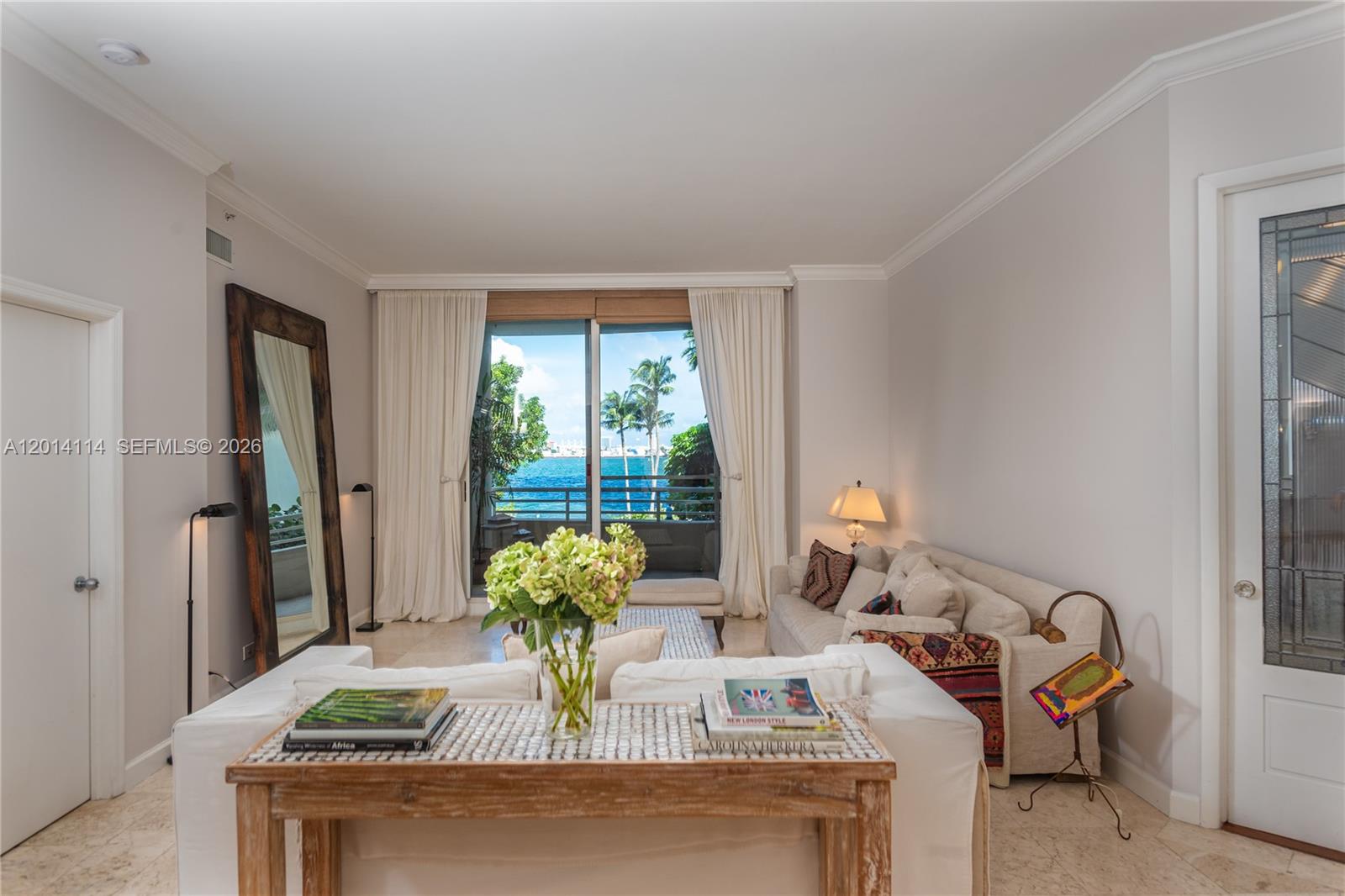 888 Brickell Key Drive, Unit 211 Miami, FL 33131 - Photo 4 of 28 a living room with furniture and a table