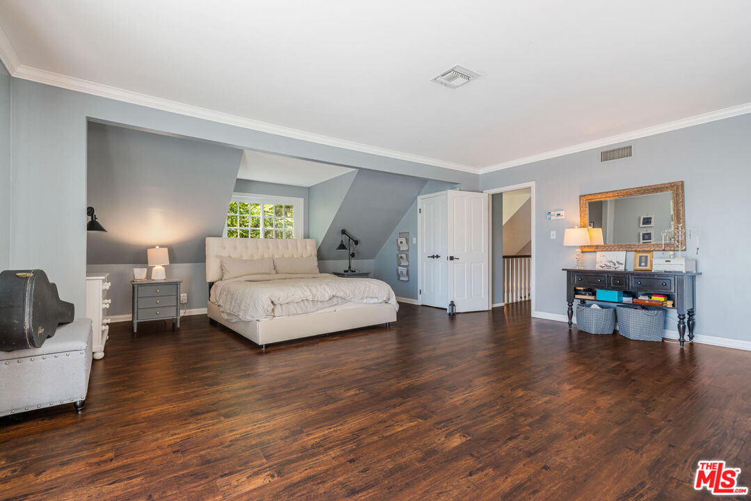 24975 Kit Carson Road Hidden Hills, CA 91302 - Photo 24 of 38 a bedroom with a bed and a couch