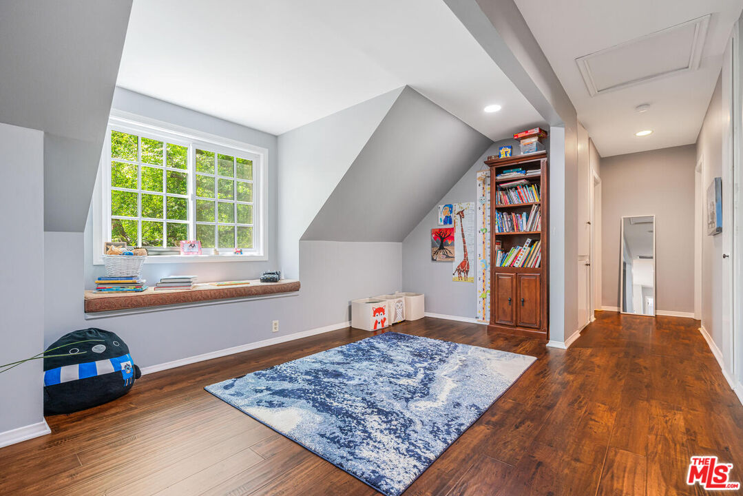 24975 Kit Carson Road Hidden Hills, CA 91302 - Photo 29 of 38 a bedroom with furniture and a window
