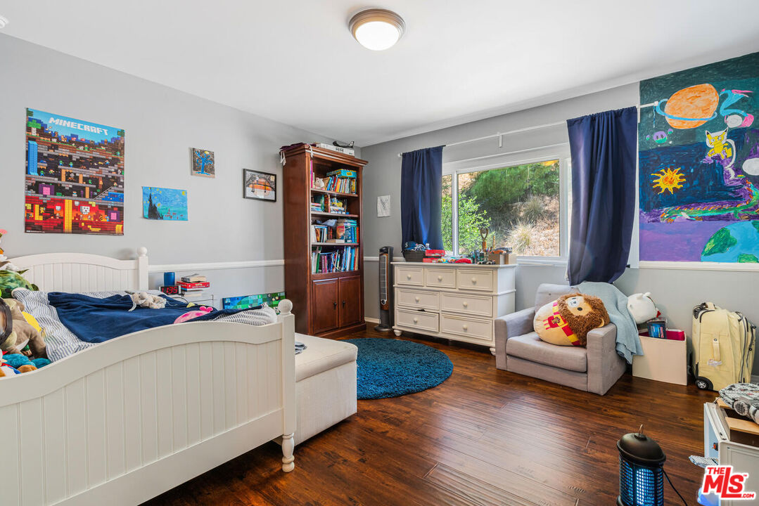 24975 Kit Carson Road Hidden Hills, CA 91302 - Photo 34 of 38 a living room with furniture and a flat screen tv