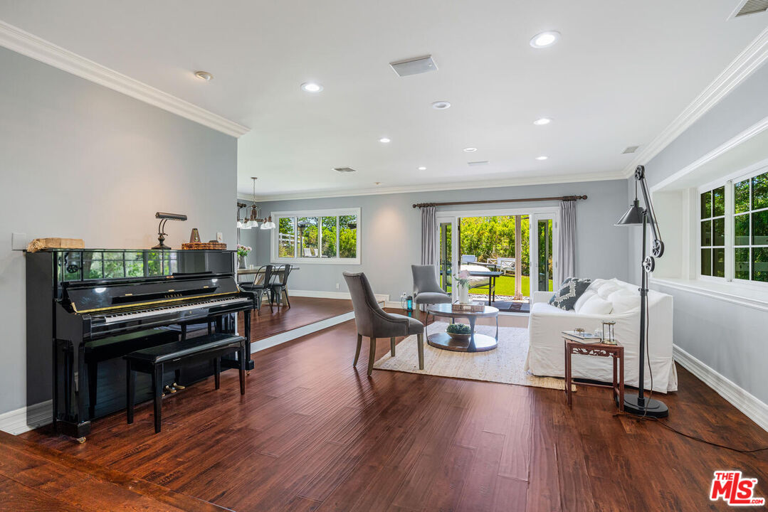 24975 Kit Carson Road Hidden Hills, CA 91302 - Photo 10 of 38 a living room with furniture and wooden floor